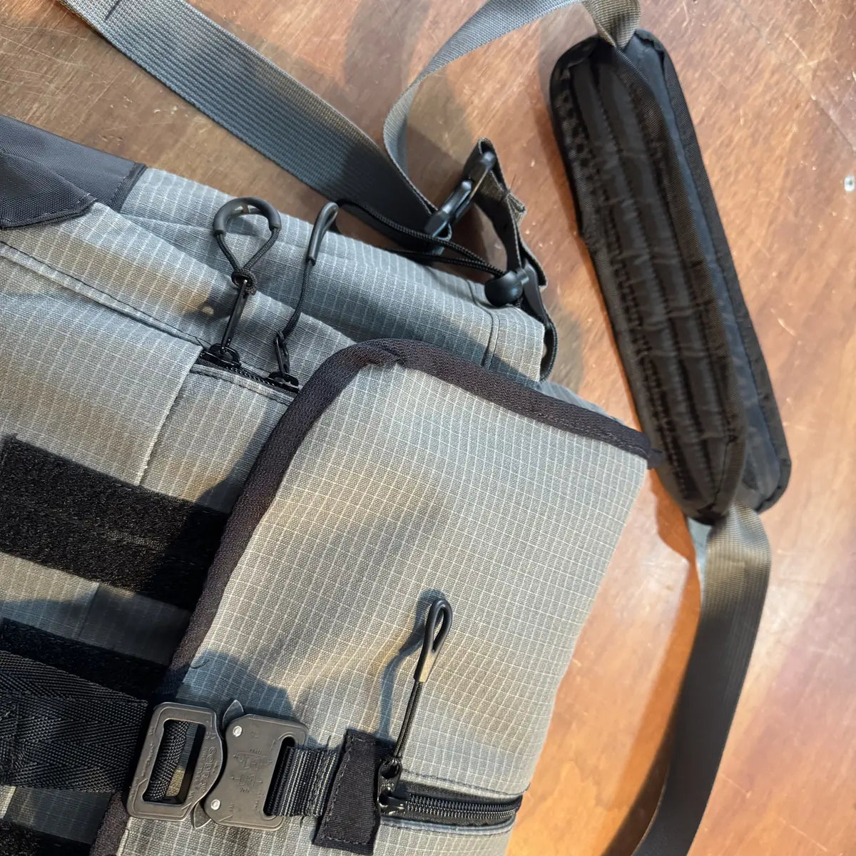 Shoulder pad, strap hardware and side zip