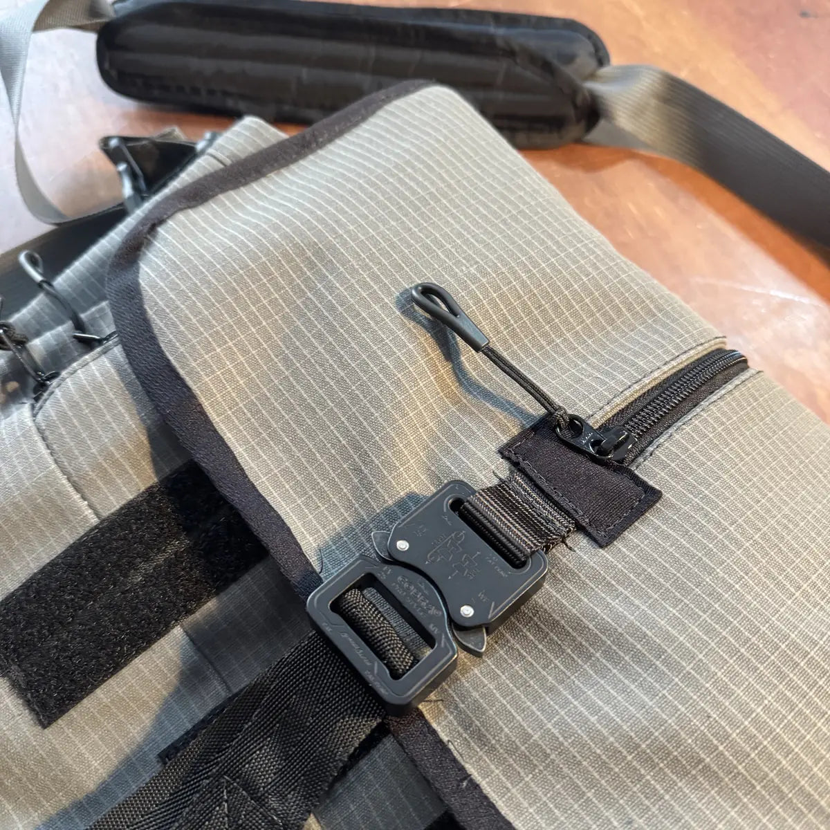 Flap, front zip and buckle strap
