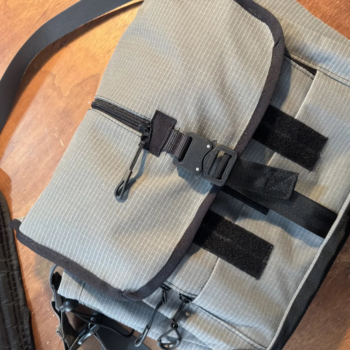 Side pocket, zip pull and bound edges