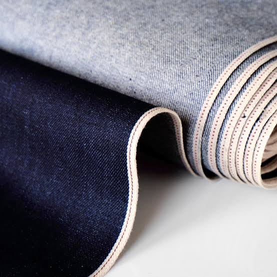 Close-up of the coloured ID line along a selvedge denim edge