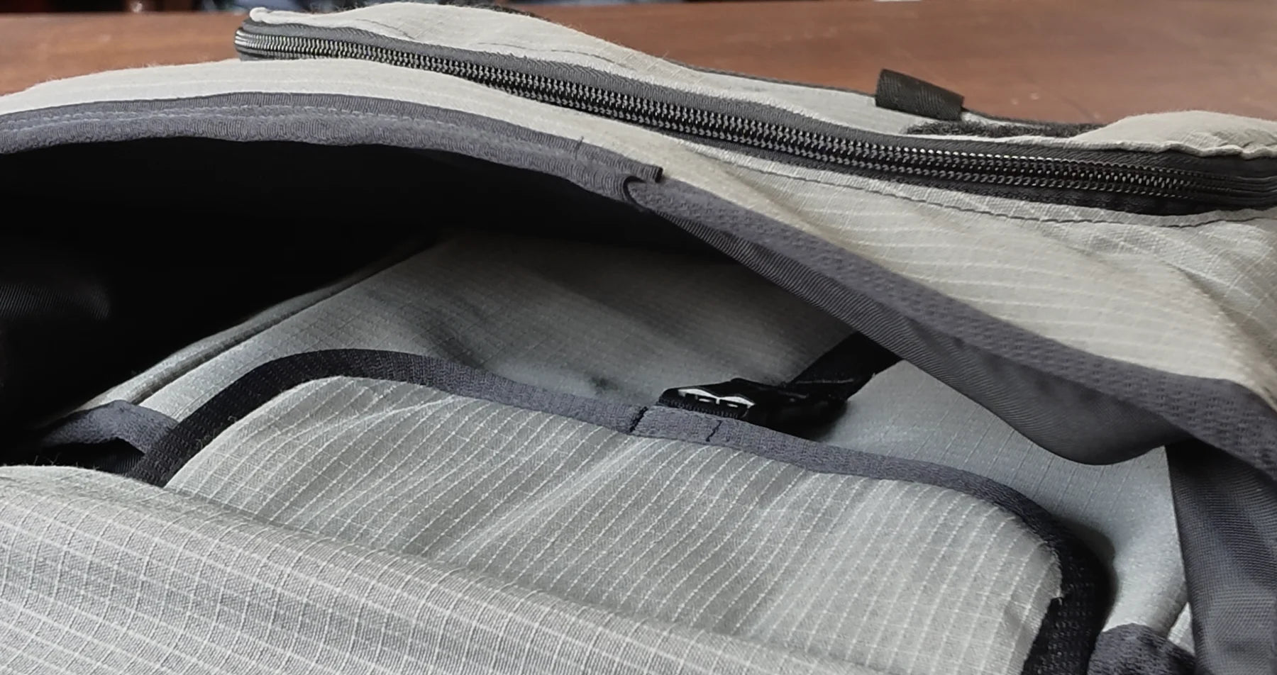 Close-up of ripstop, black binding and a zip